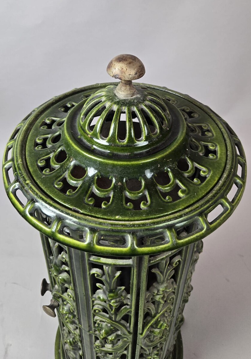 Green enameled cast iron wood-burning stove, circa 1900
