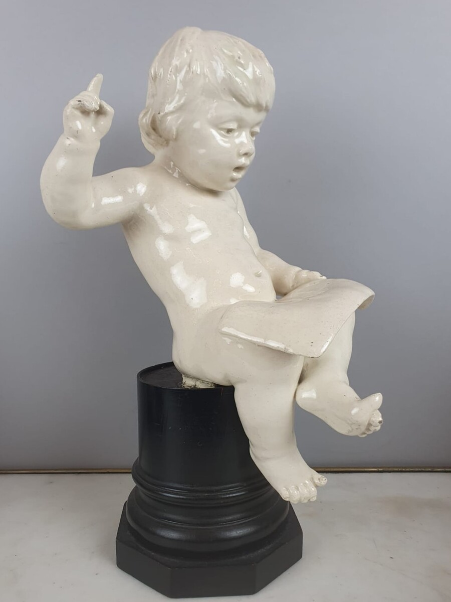 Group of 5 earthenware musician cherubs, late 19th, early 20th. Height of the largest: 35 cm.