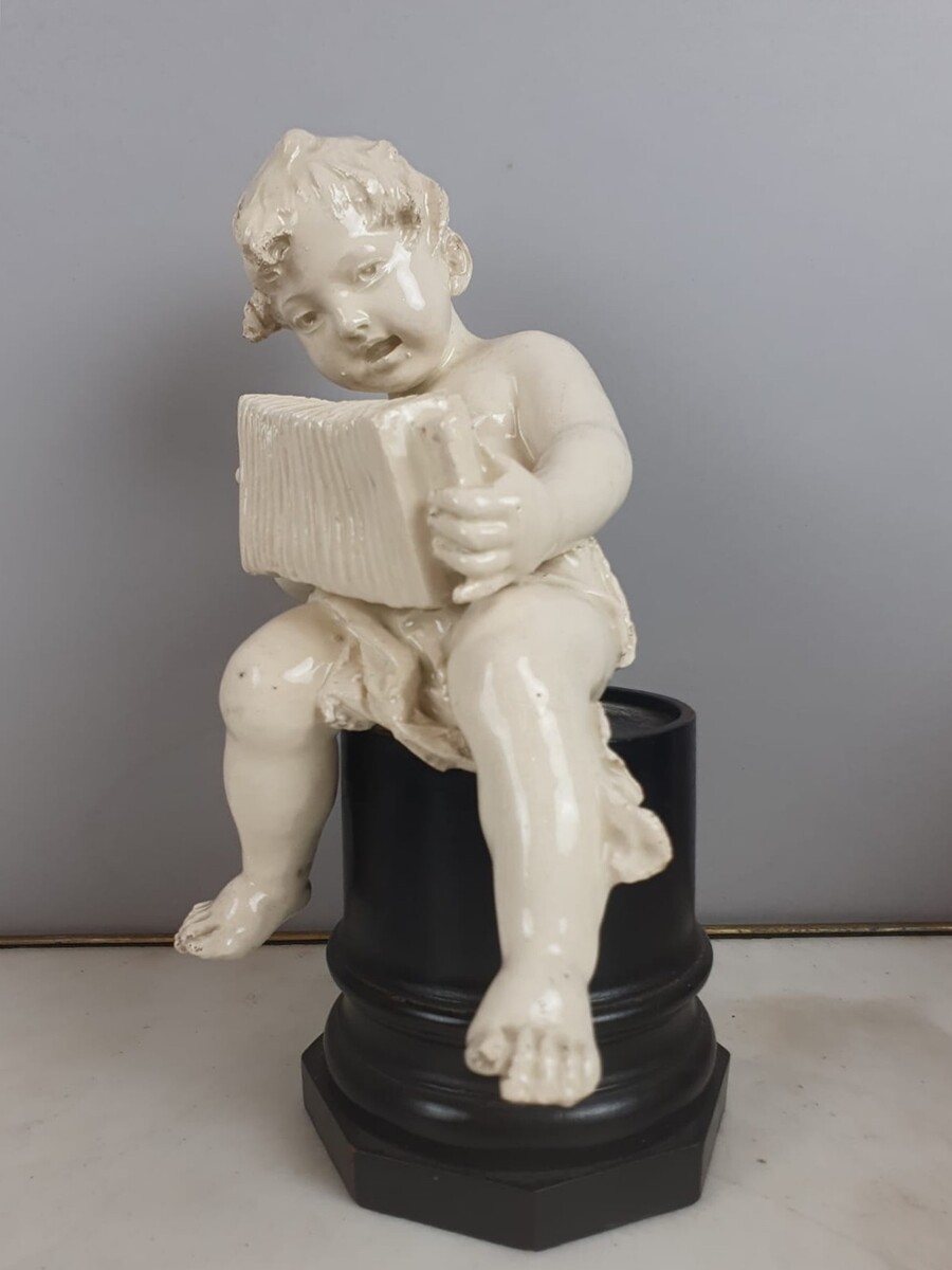 Group of 5 earthenware musician cherubs, late 19th, early 20th. Height of the largest: 35 cm.