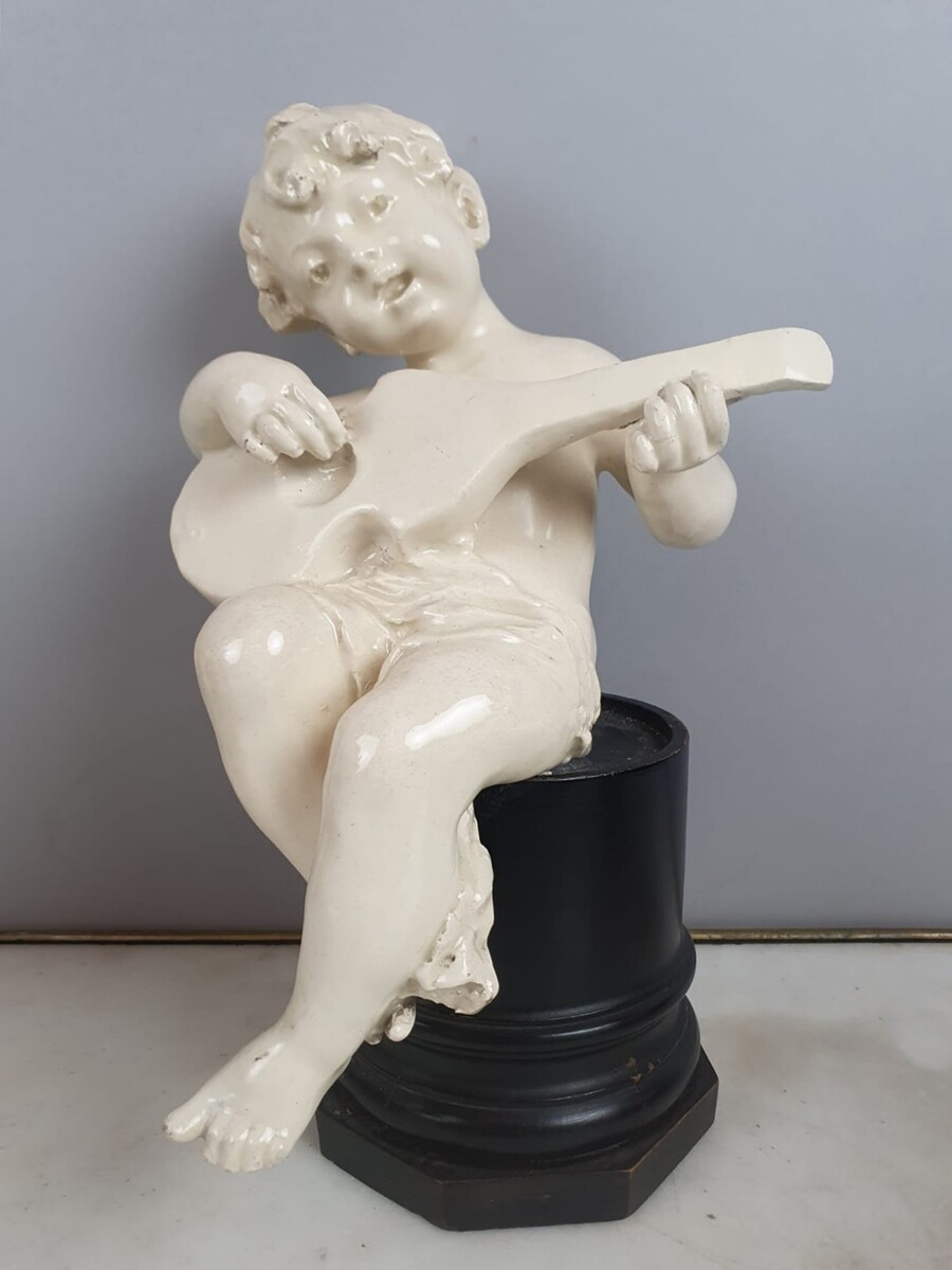 Group of 5 earthenware musician cherubs, late 19th, early 20th. Height of the largest: 35 cm.