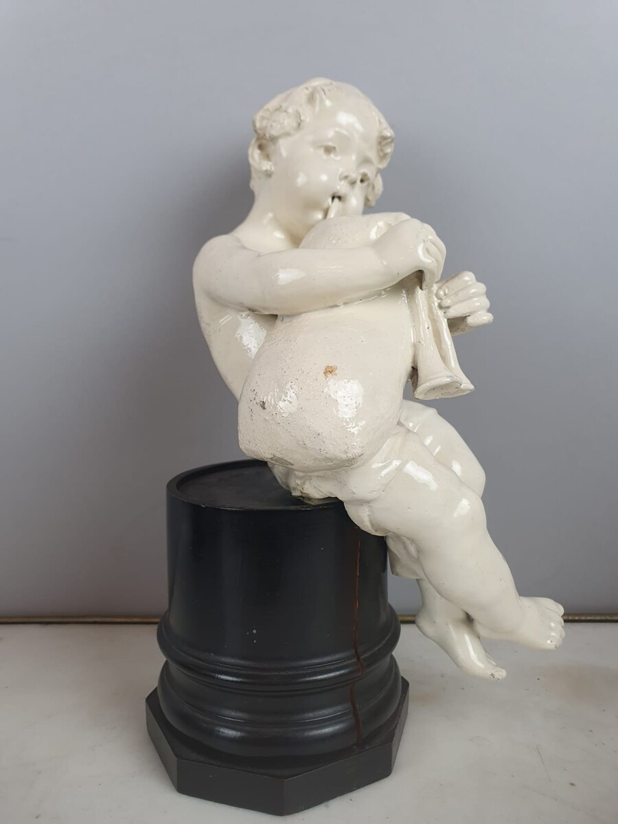 Group of 5 earthenware musician cherubs, late 19th, early 20th. Height of the largest: 35 cm.