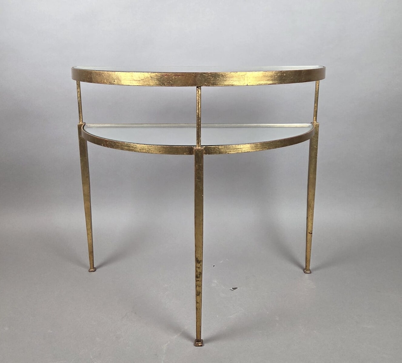 Half-moon console table in gilded wrought iron with glass shelves