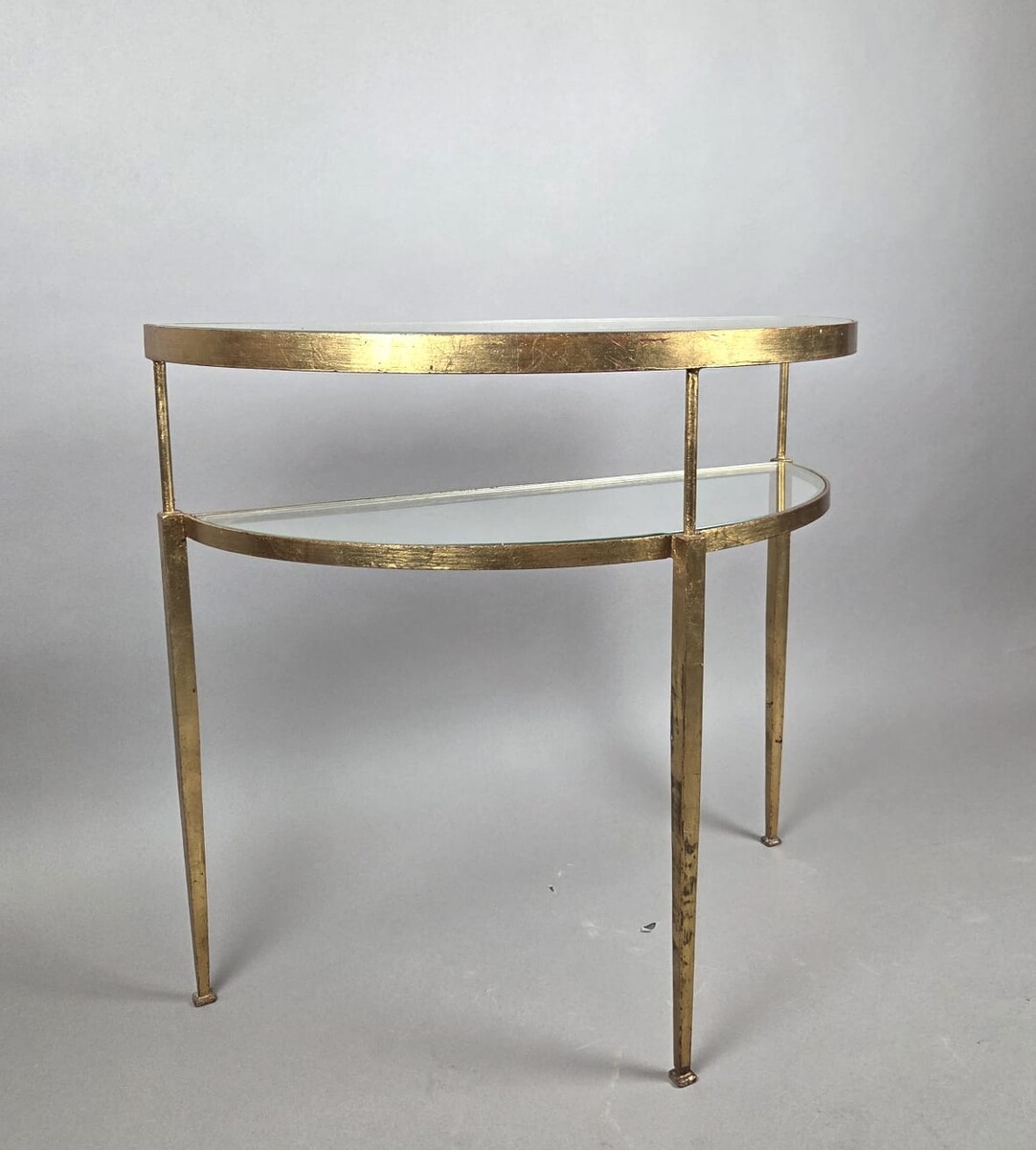 Half-moon console table in gilded wrought iron with glass shelves