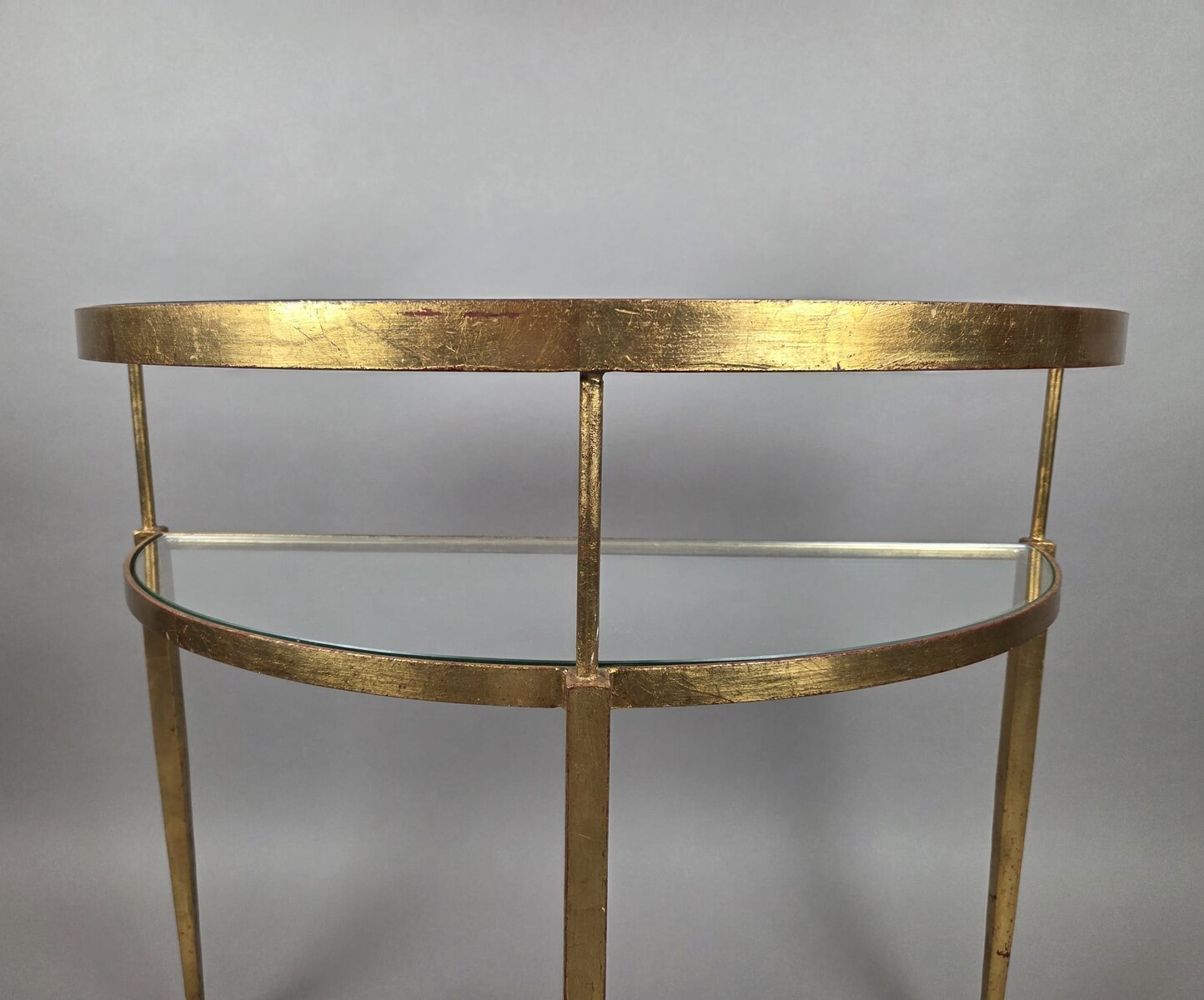 Half-moon console table in gilded wrought iron with glass shelves