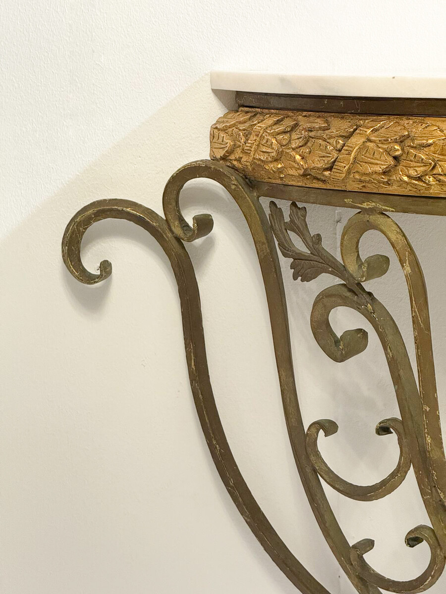 Half-moon wrought-iron console table with a marble top