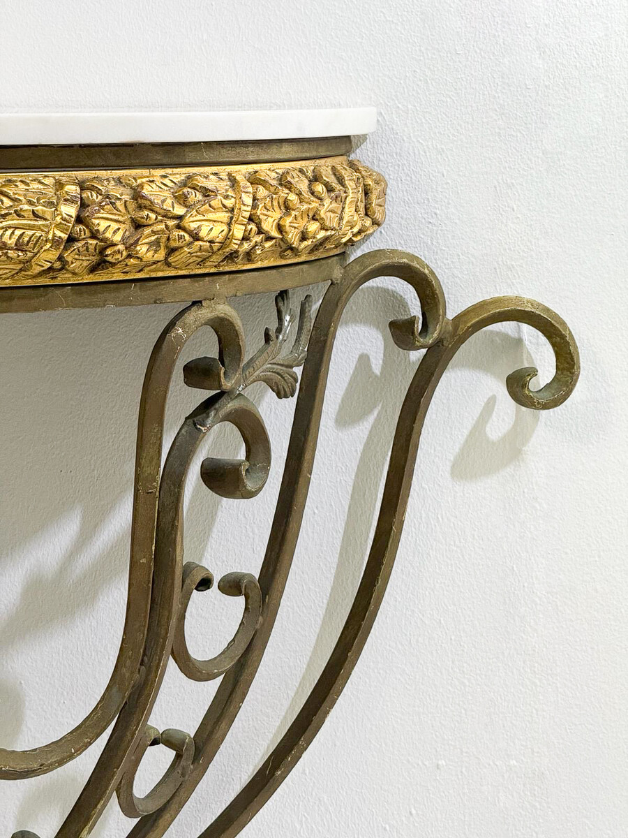 Half-moon wrought-iron console table with a marble top