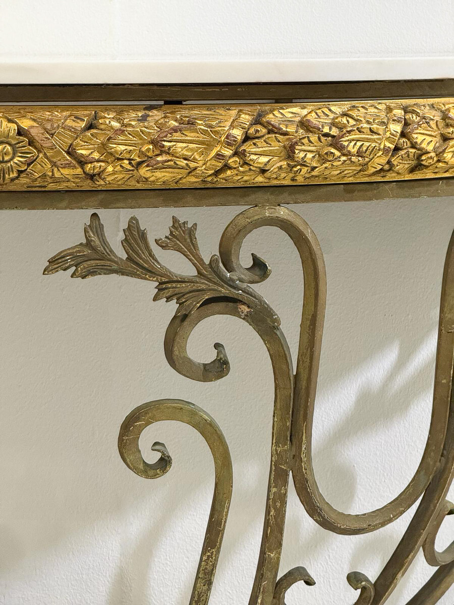 Half-moon wrought-iron console table with a marble top