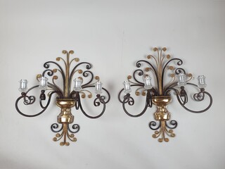In the style of Bagues, pair of wrought iron and glass wall lights