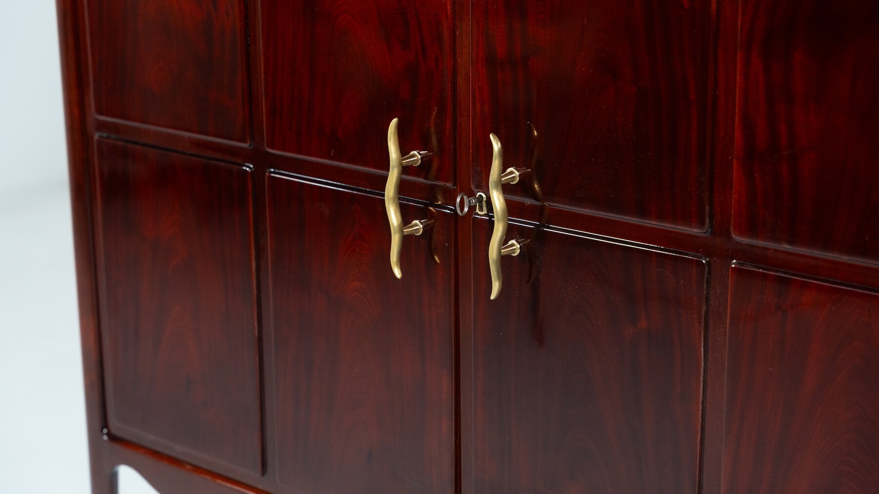 In the style of Paolo Buffa, mahogany cabinet, Italy circa 1950