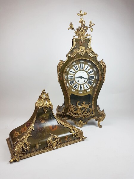 Large Louis XV style cartel in varnish decorated with polychrome flowers and bronze