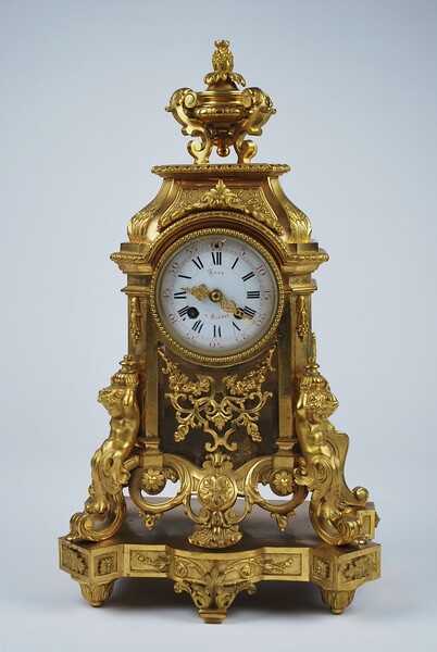 Louis XIV style clock in gilded bronze,