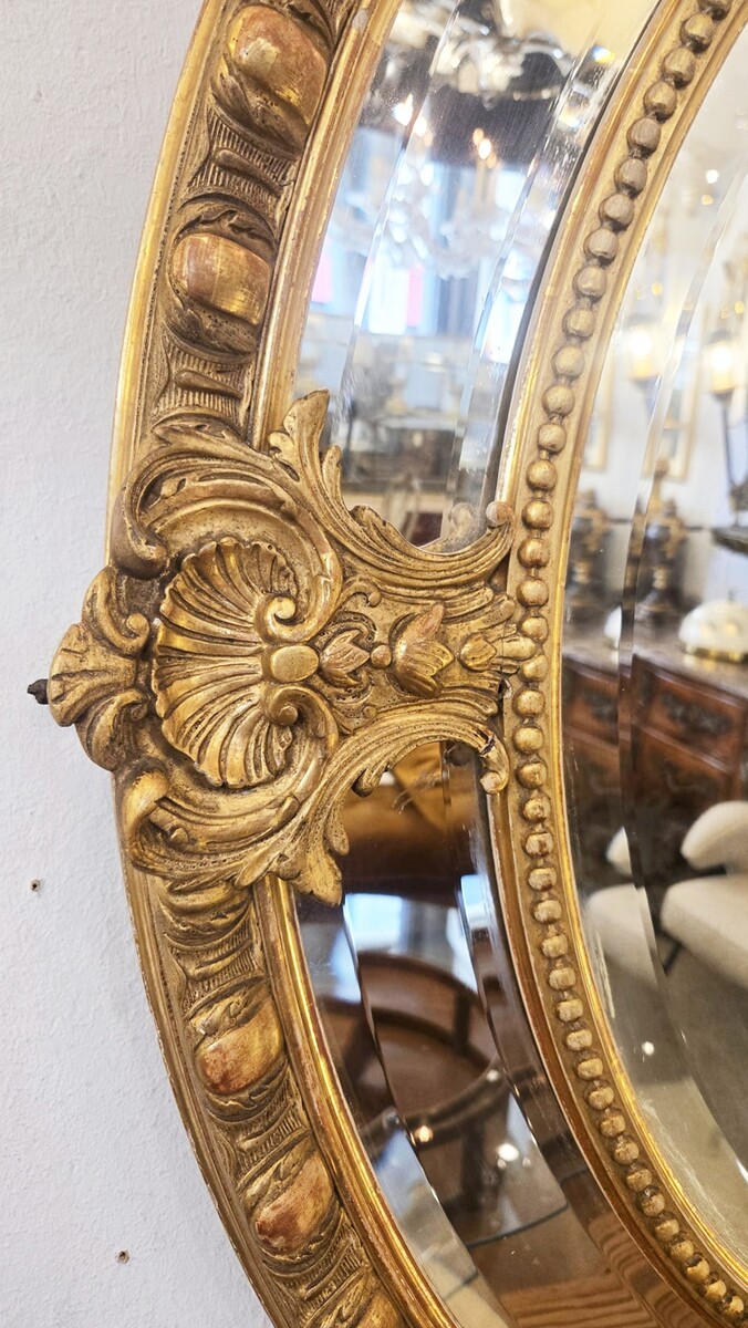 Louis XIV style medallion mirror in wood and gilded stucco, 19th