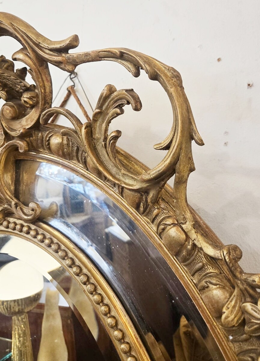 Louis XIV style medallion mirror in wood and gilded stucco, 19th