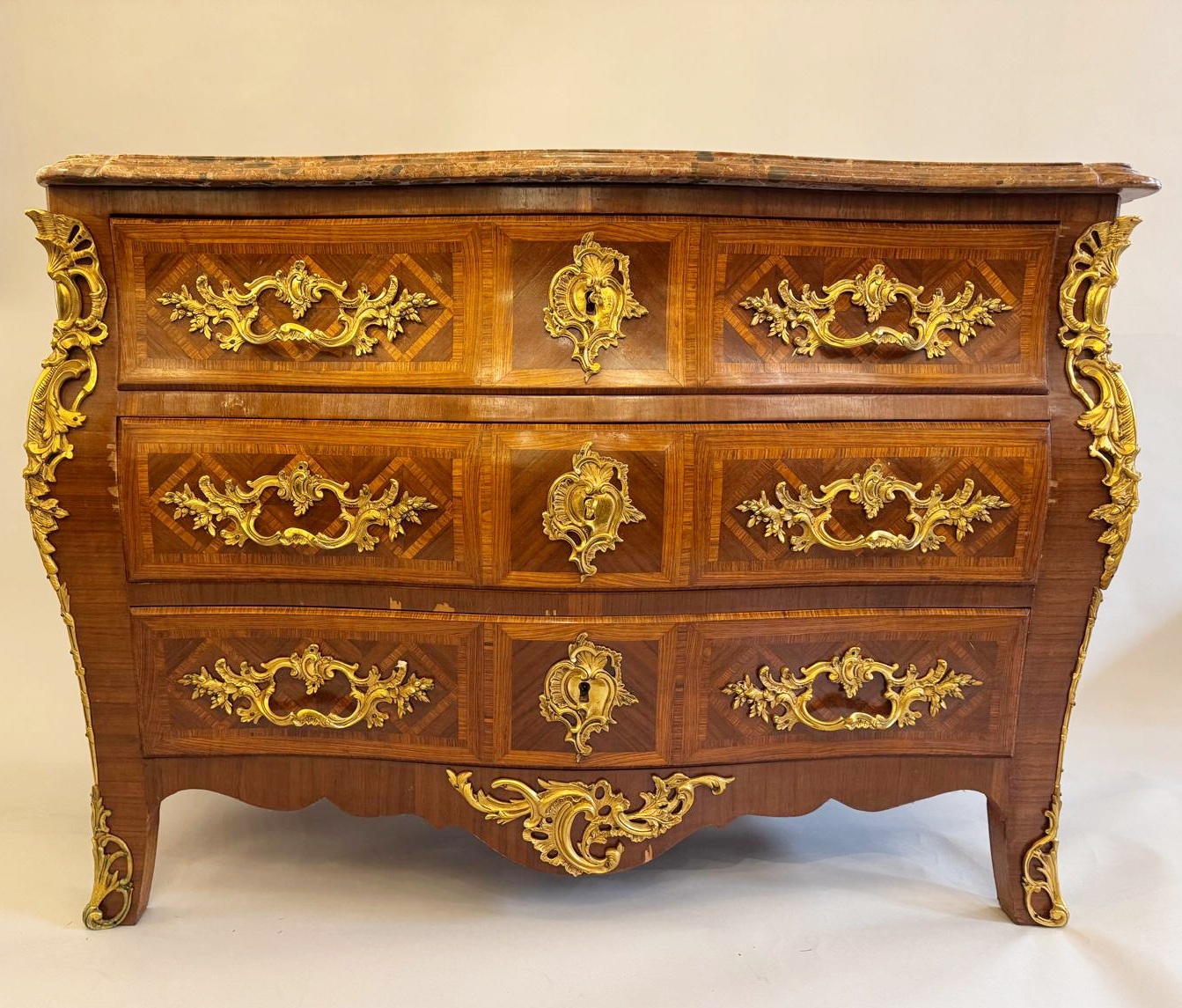 Louis XV style marquetry crossbow chest of drawers