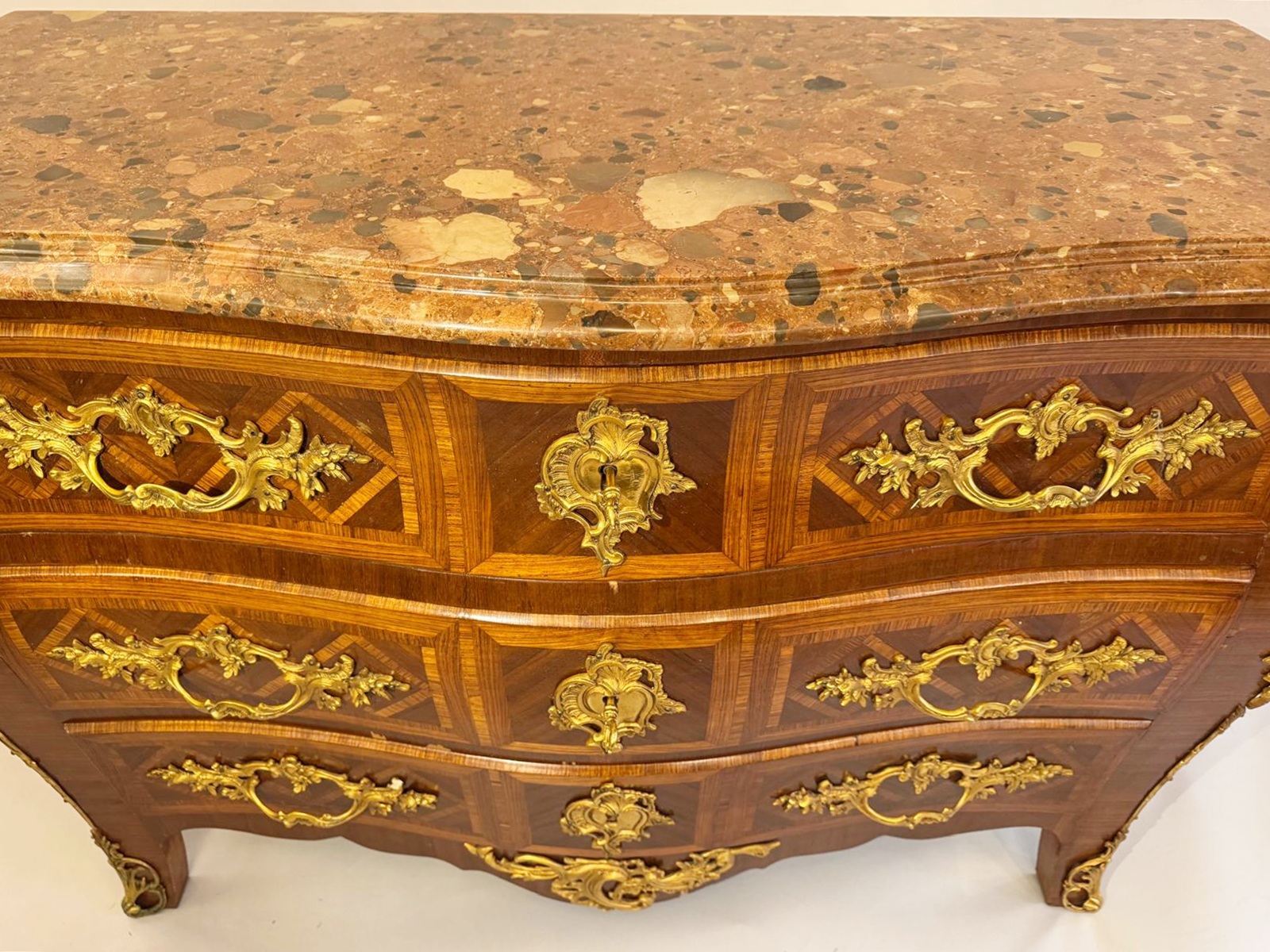 Louis XV style marquetry crossbow chest of drawers