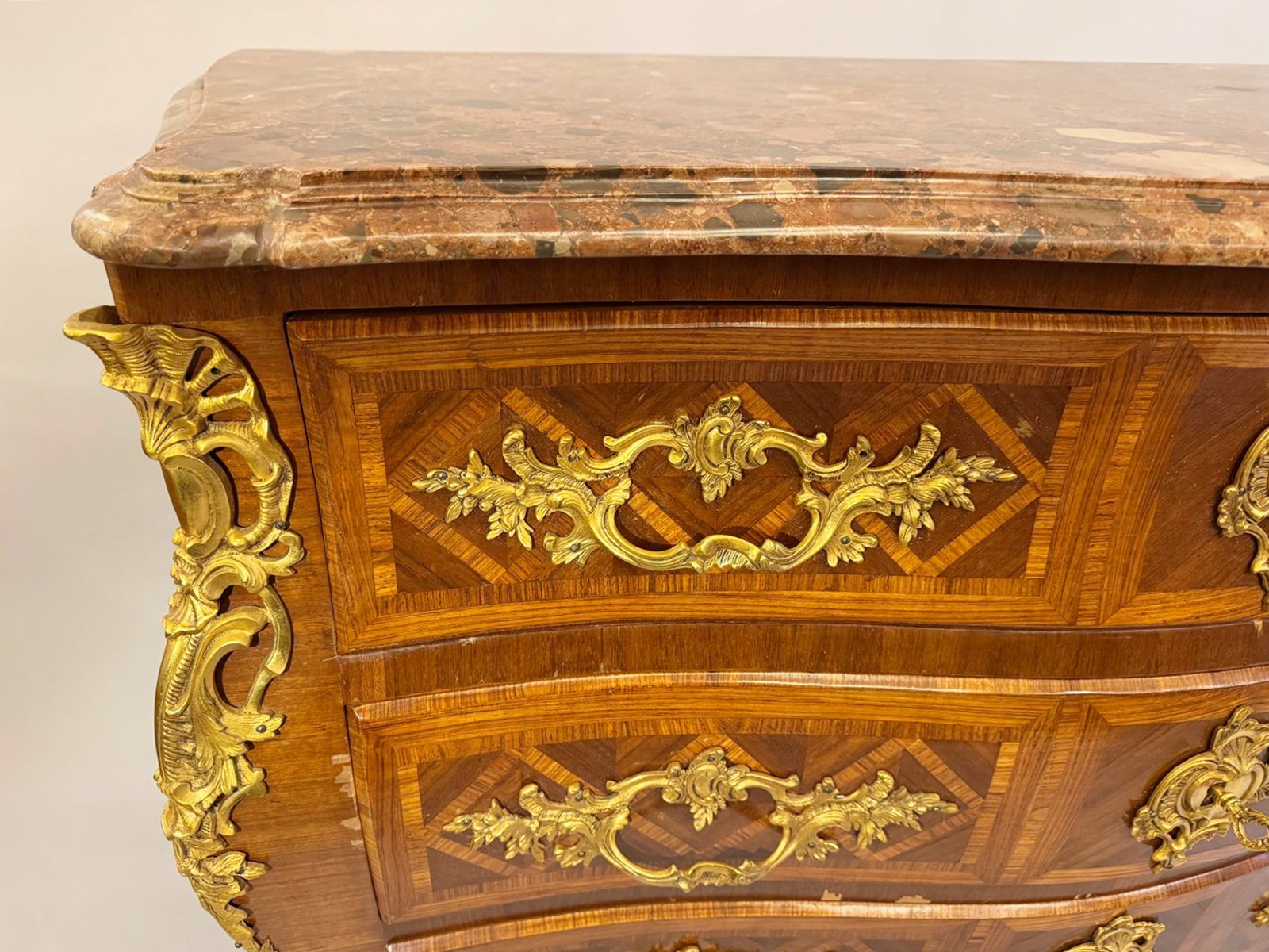 Louis XV style marquetry crossbow chest of drawers