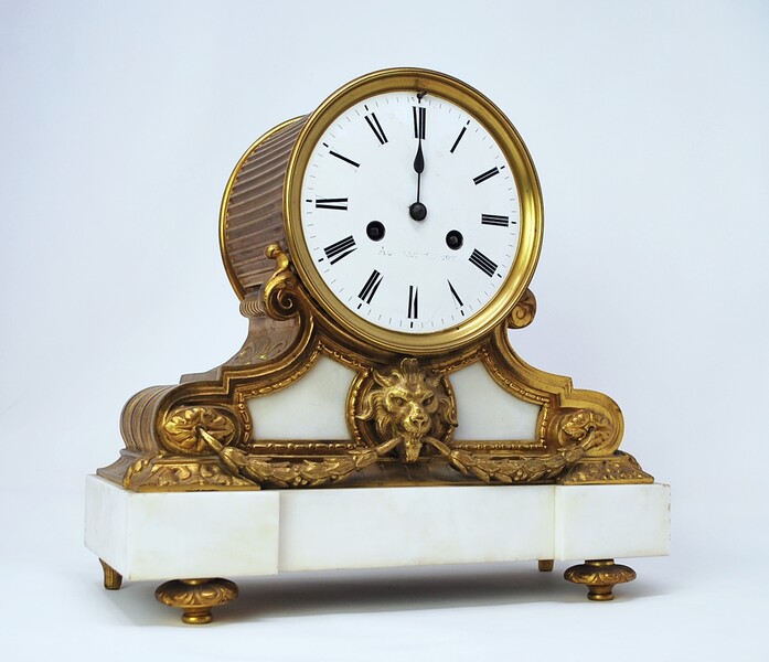 Louis XVI clock in white marble and gilt bronze