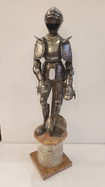 Miniature armor in silver metal on a marble base
