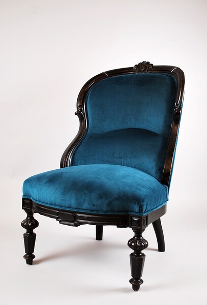 Napoleon III low chair in blackened wood.