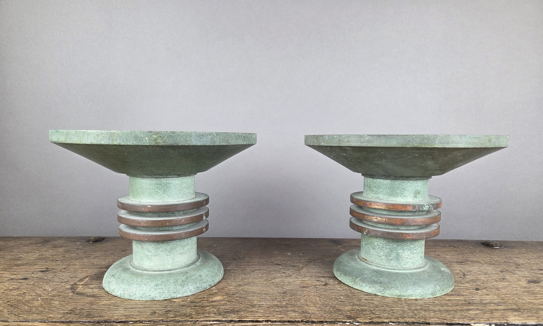 Pair of Art Deco bronze candle-holders