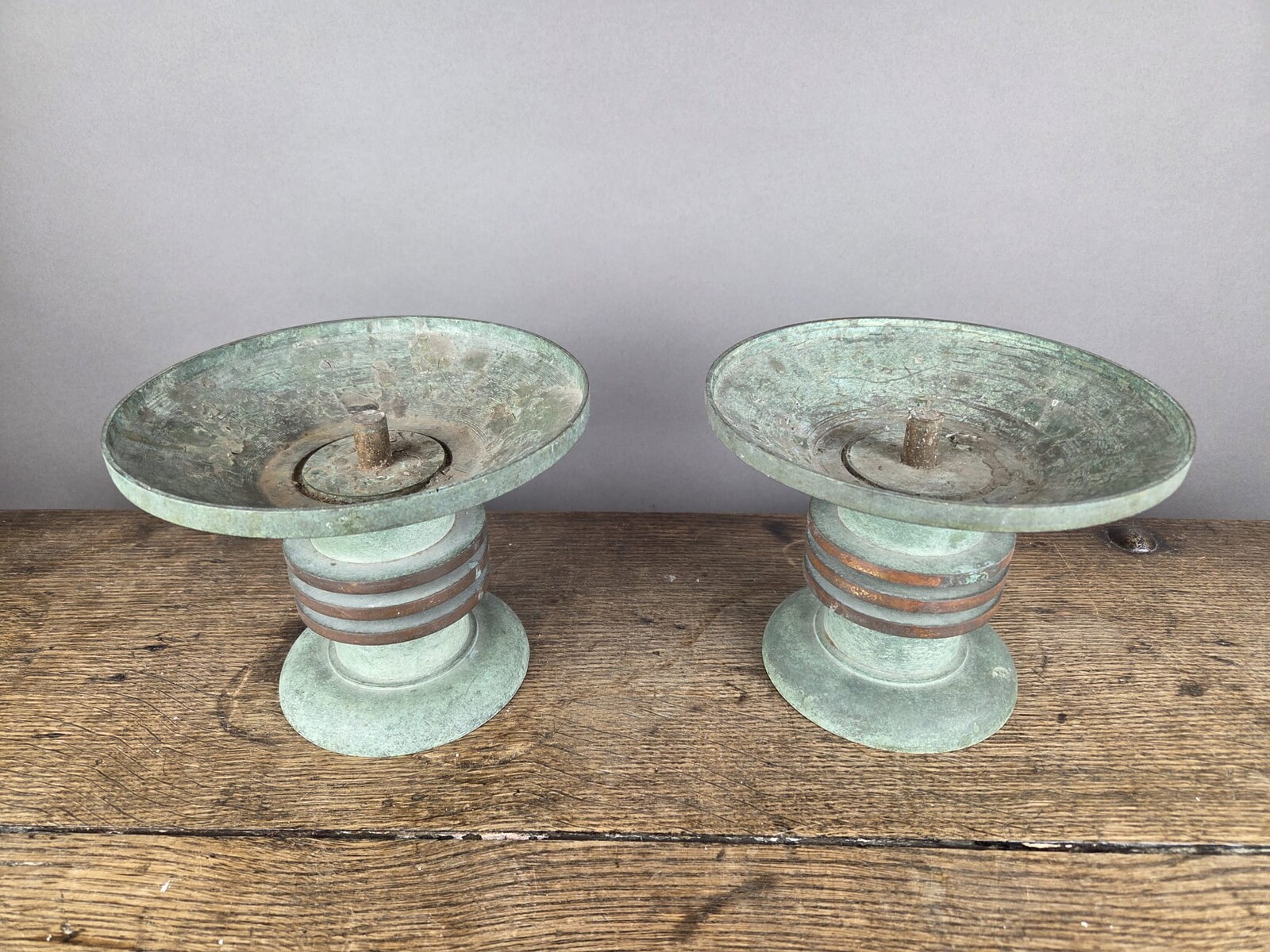 Pair of Art Deco bronze candle-holders