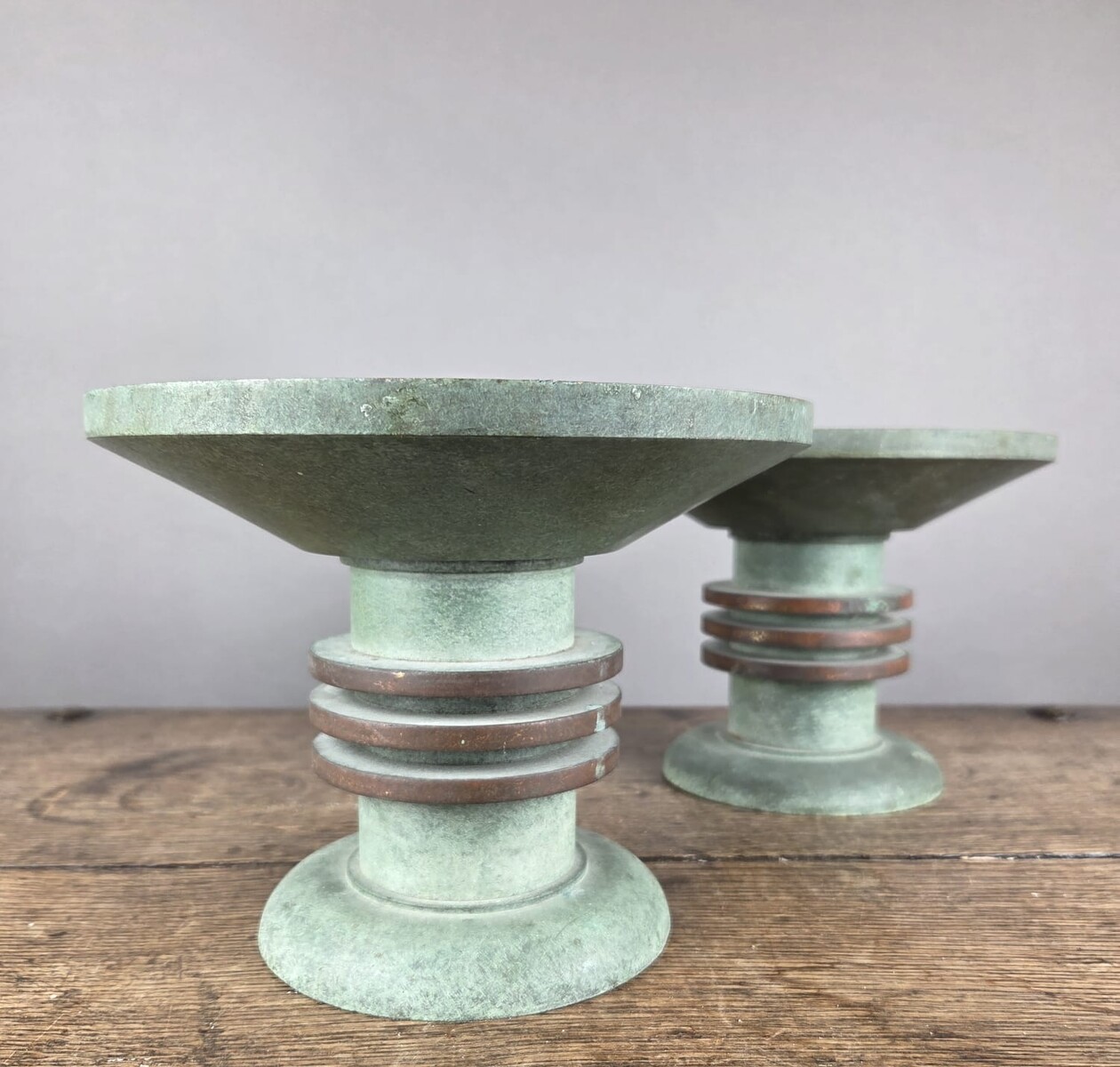 Pair of Art Deco bronze candle-holders
