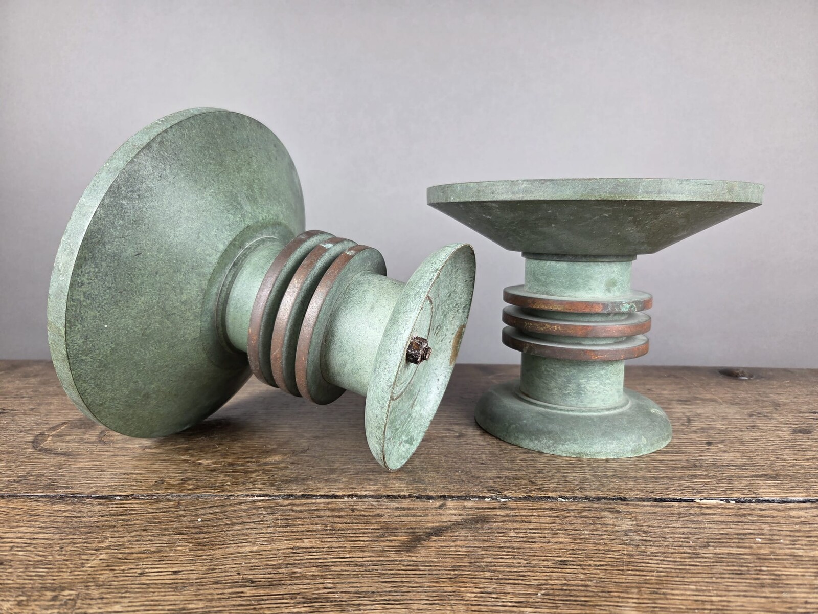 Pair of Art Deco bronze candle-holders