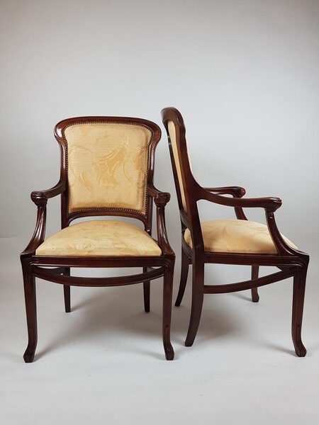 Pair of Art Nouveau period armchairs in stained beech