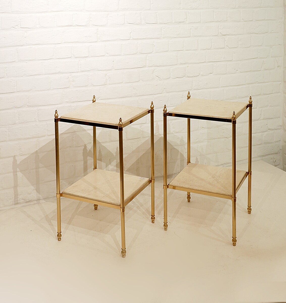 Pair of brass and travertine end tables, circa 1970