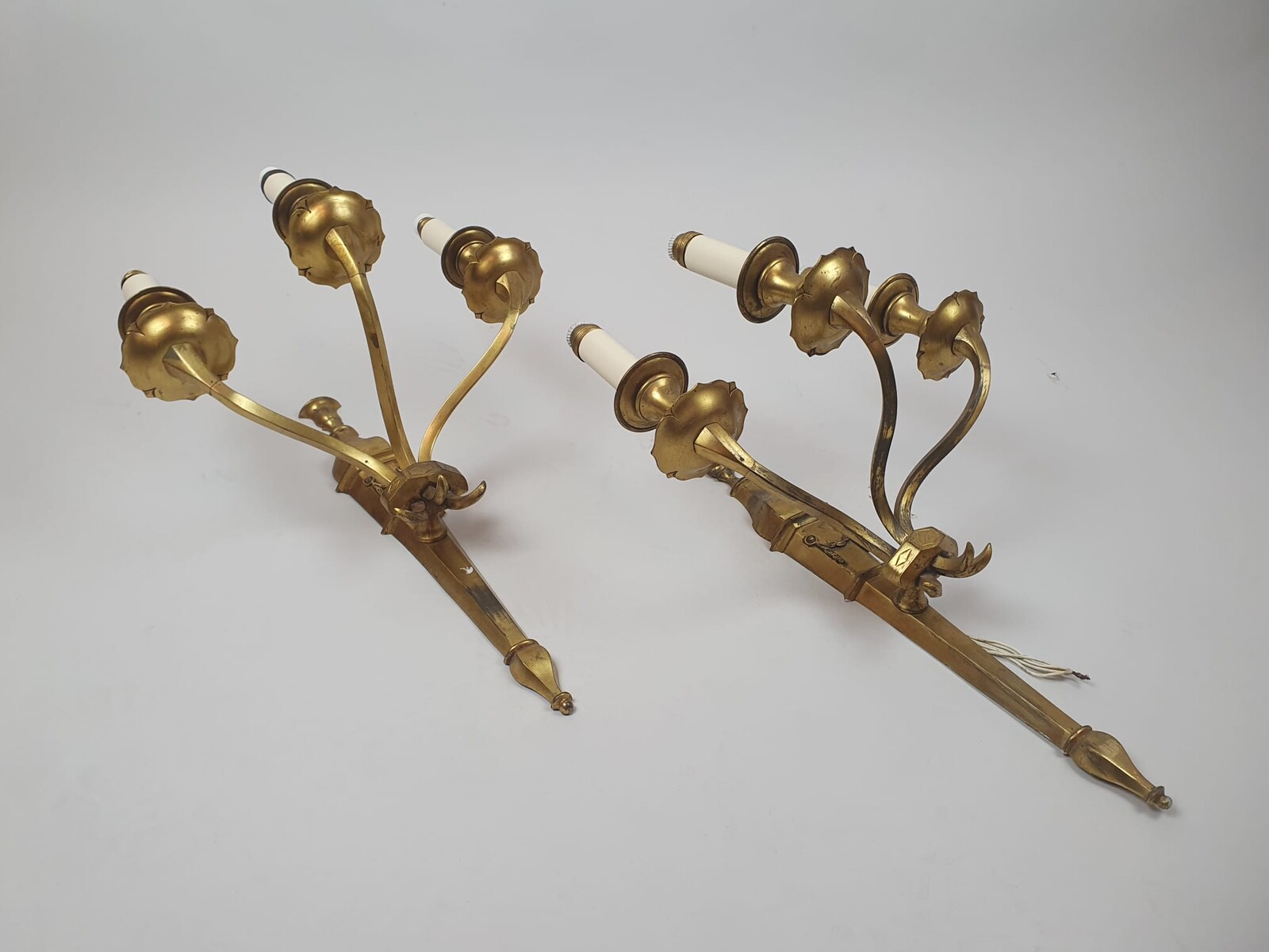 Pair of bronze and brass wall lights