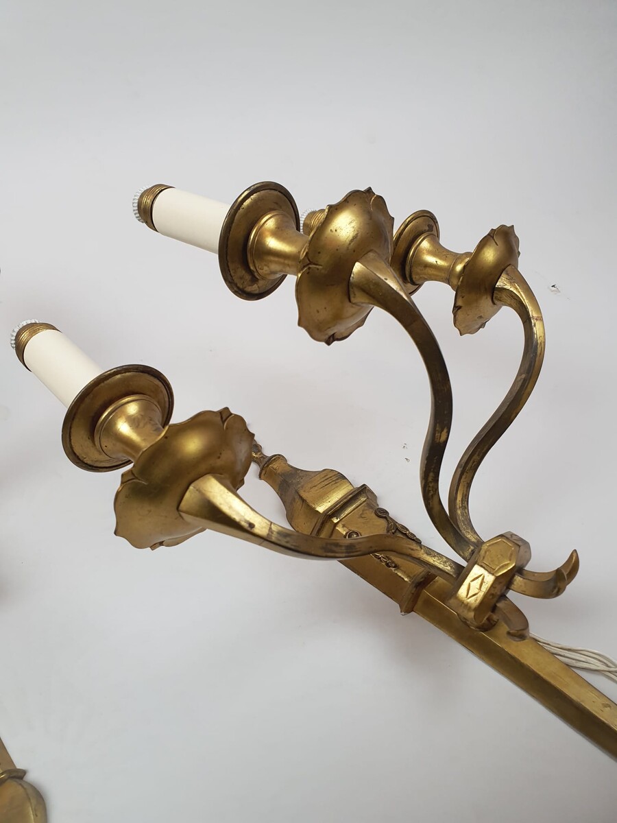 Pair of bronze and brass wall lights