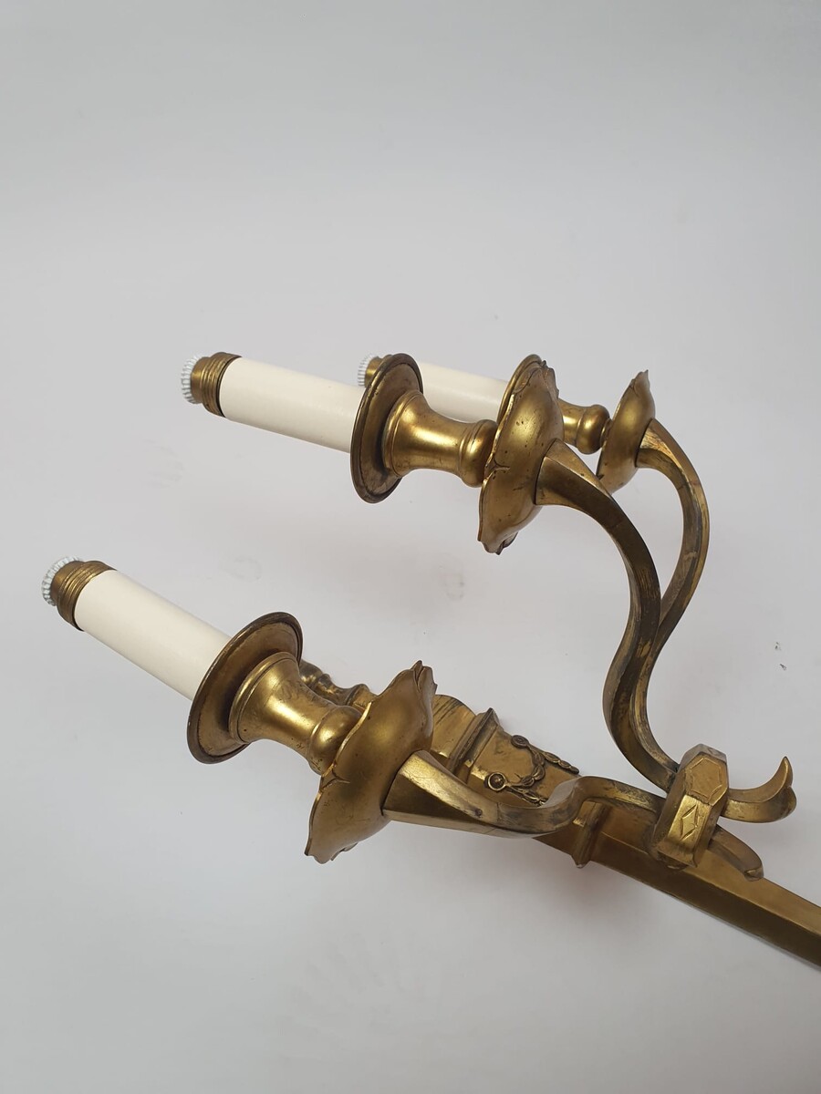 Pair of bronze and brass wall lights