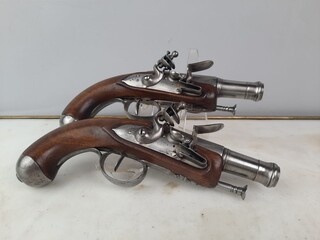 Pair of flintlock pistols, worked and blunderbuss barrels