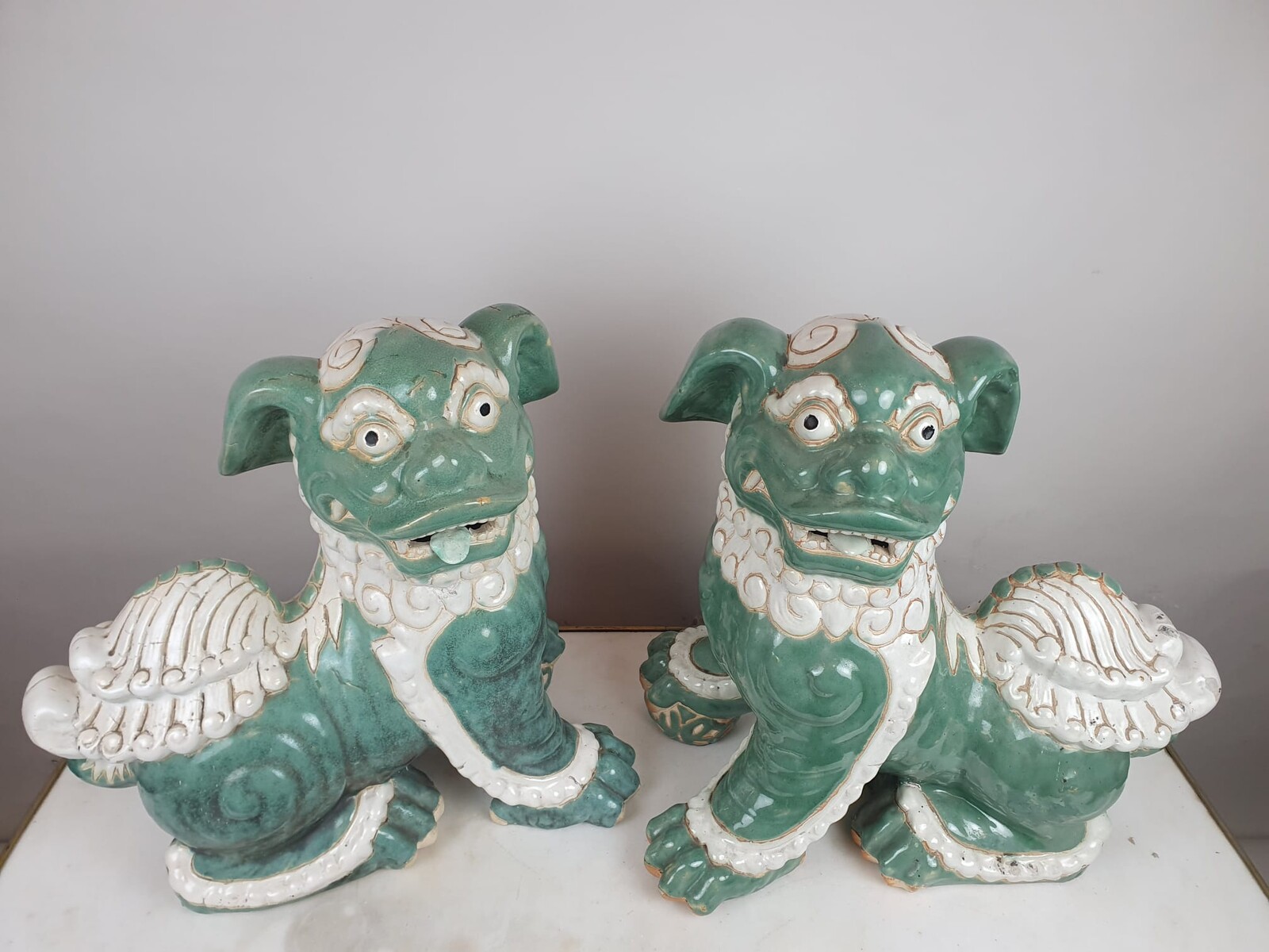 Pair of Fô dogs in glazed earthenware, early 20th