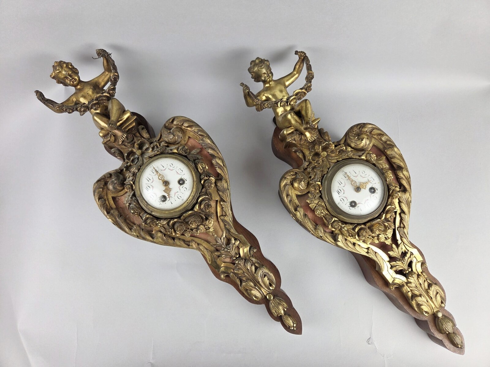 Pair of gilded bronze and wood cartels, early 20th century