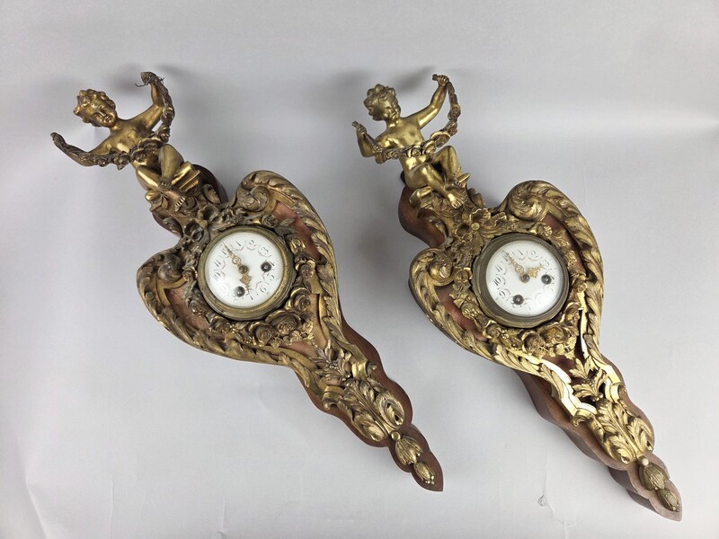 Pair of gilded bronze and wood cartels, early 20th century