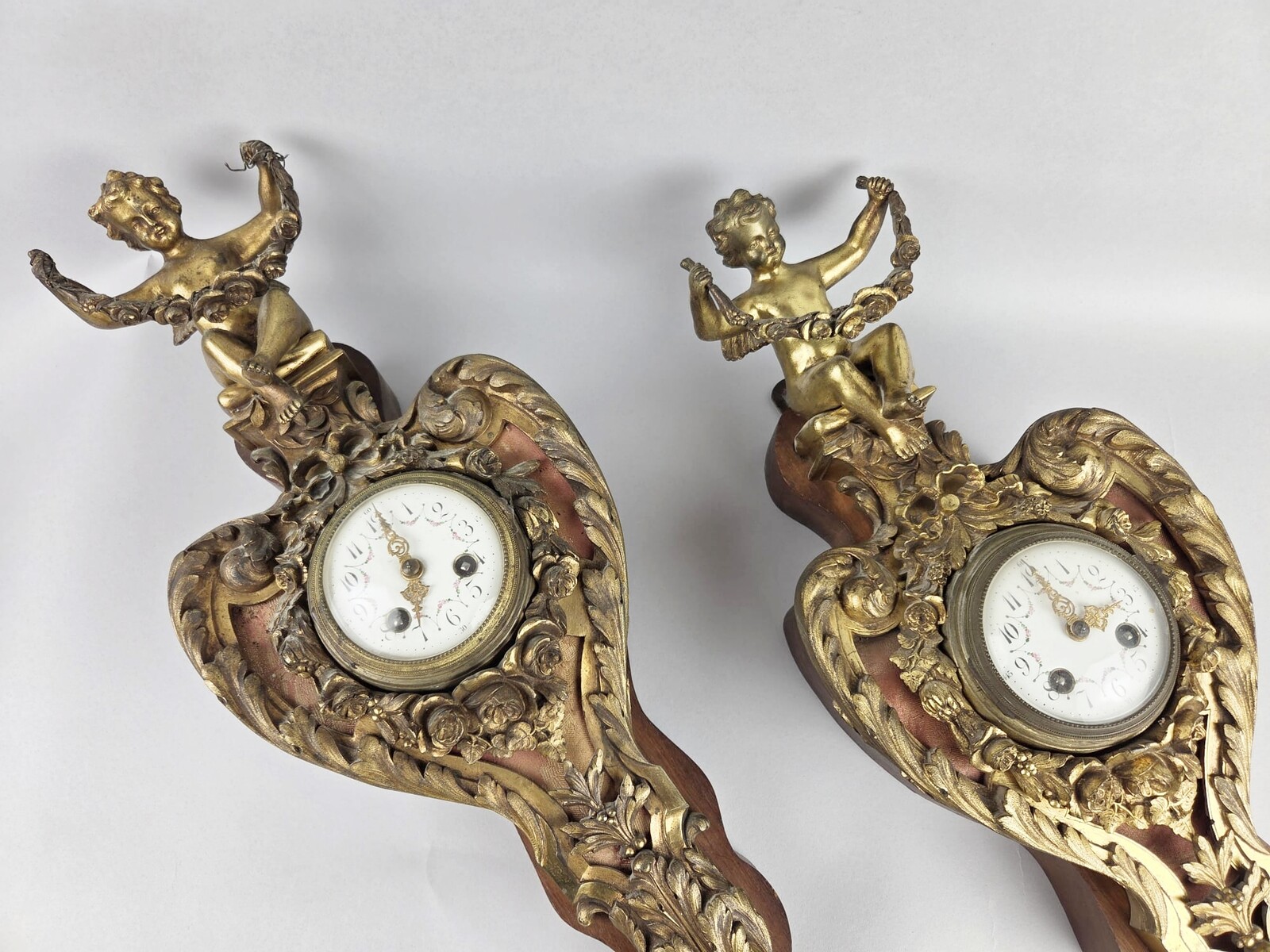 Pair of gilded bronze and wood cartels, early 20th century