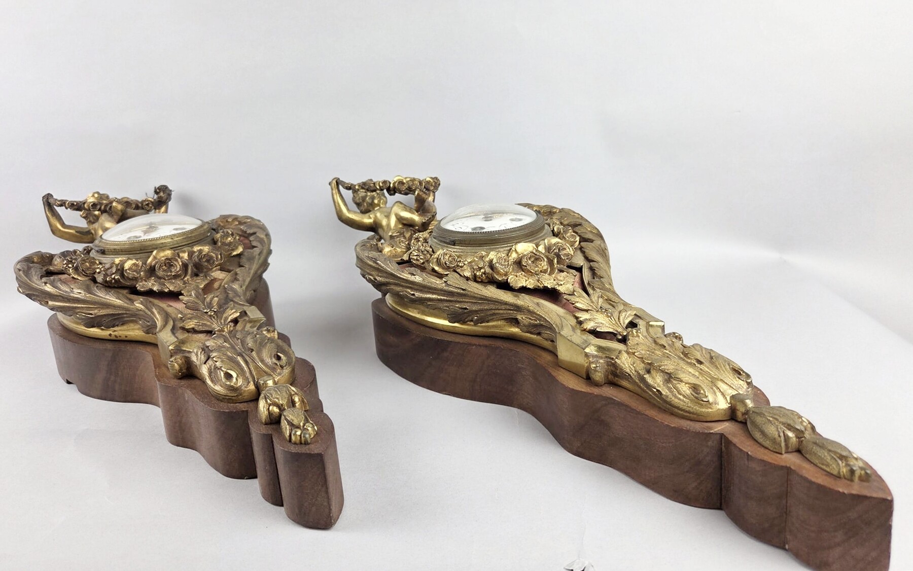 Pair of gilded bronze and wood cartels, early 20th century