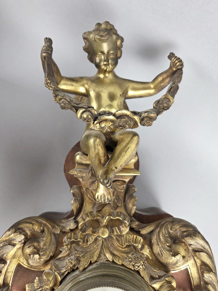 Pair of gilded bronze and wood cartels, early 20th century