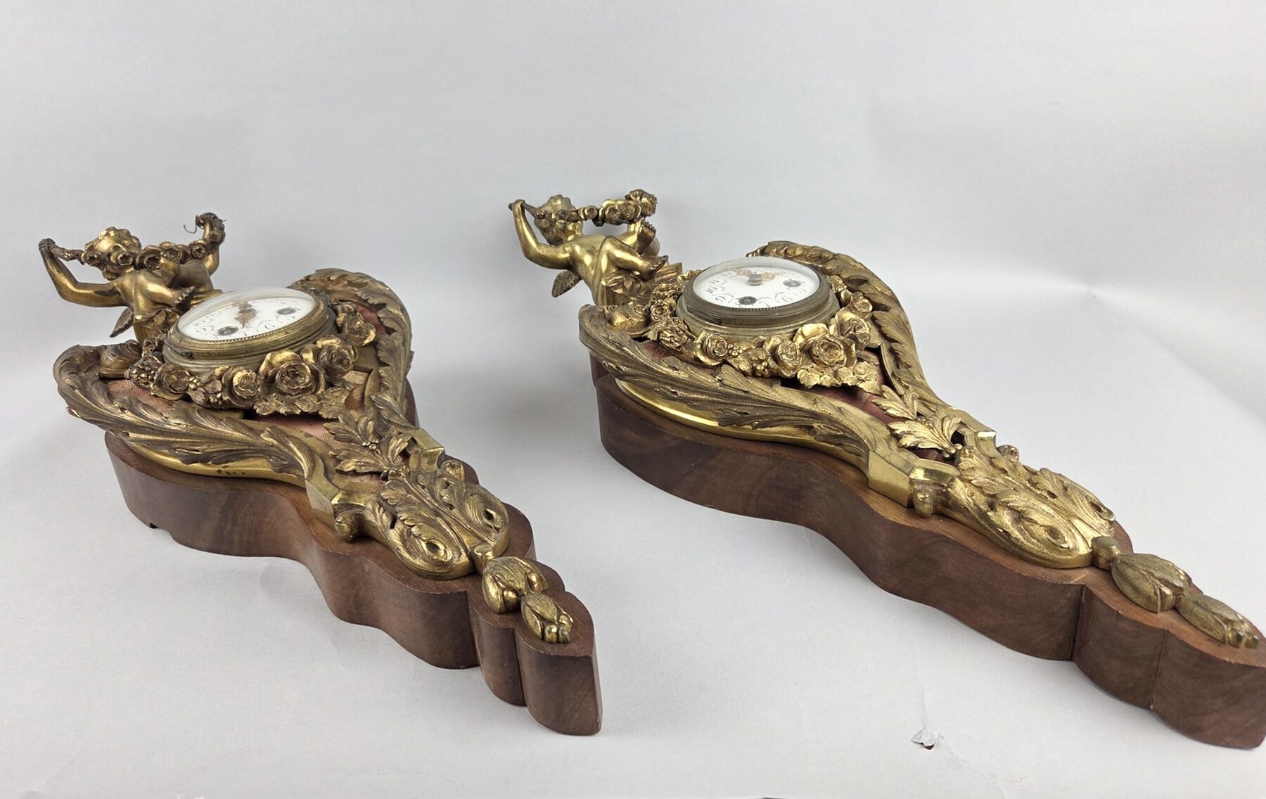 Pair of gilded bronze and wood cartels, early 20th century