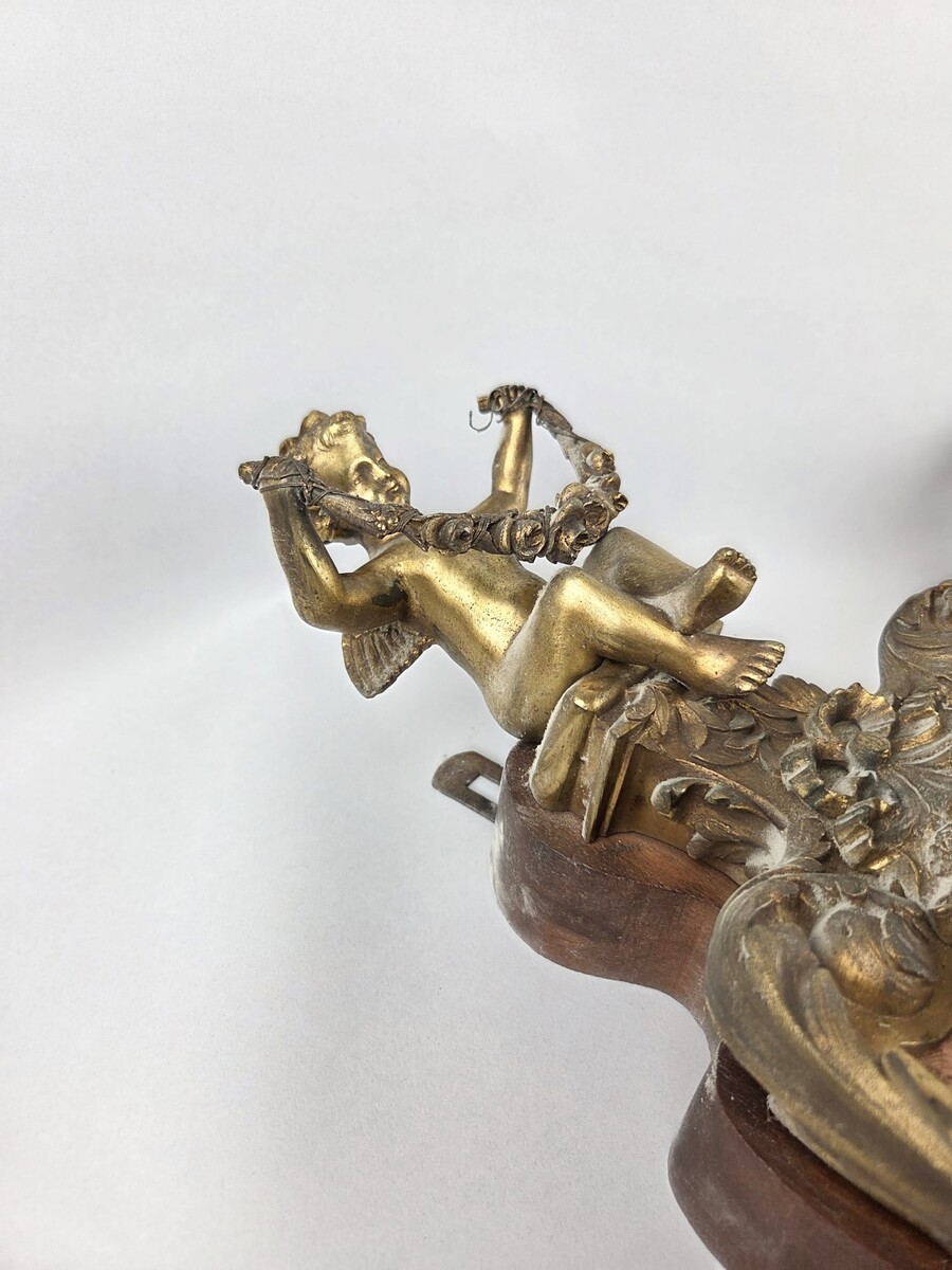 Pair of gilded bronze and wood cartels, early 20th century
