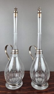 Pair of large crystal and silver-plated metal ewers, late 19th century