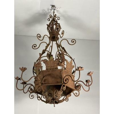 Pair of large rusty wrought iron chandeliers