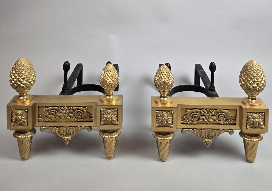Pair of Louis XVI period gilt bronze andirons
