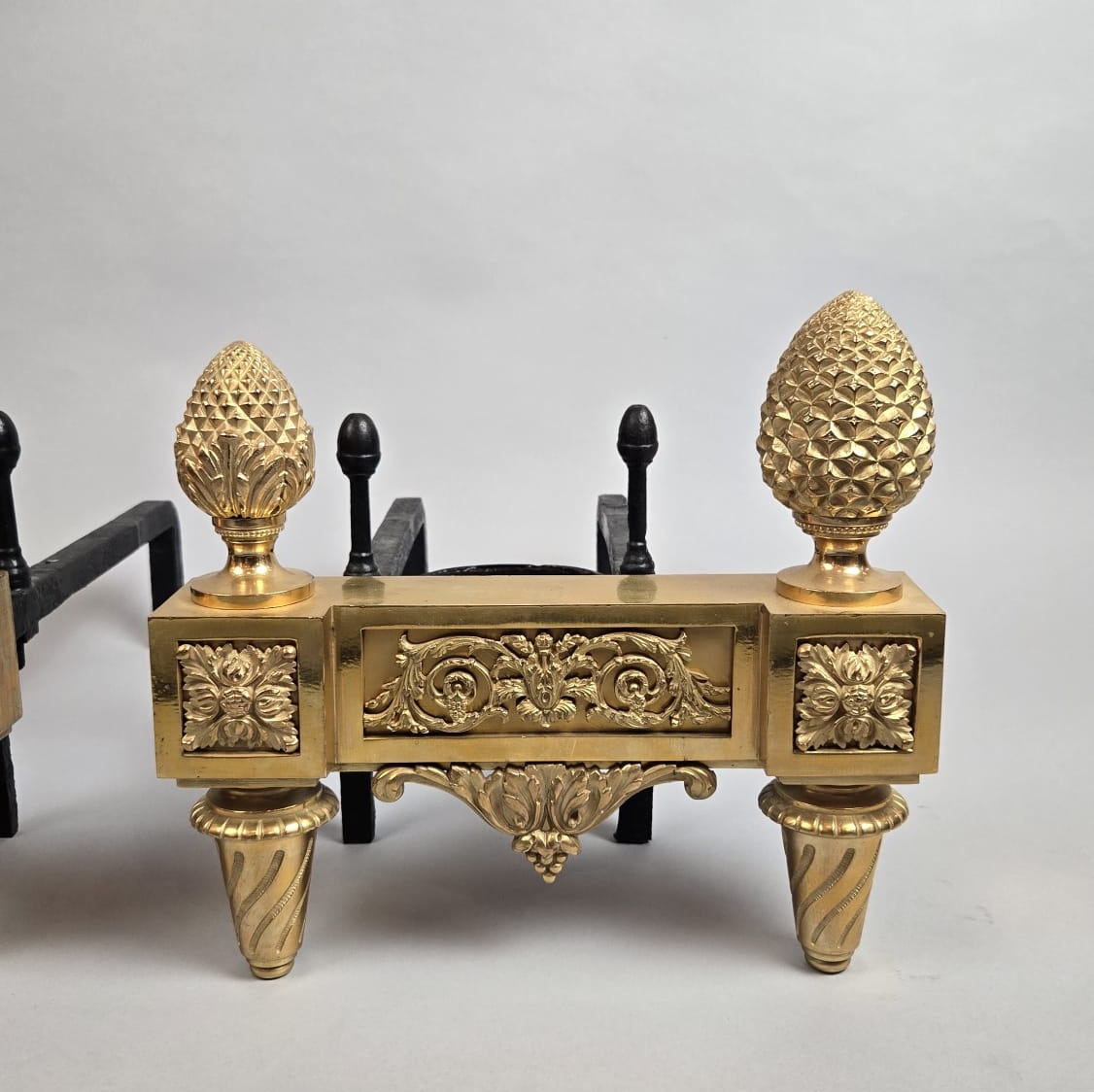 Pair of Louis XVI period gilt bronze andirons
