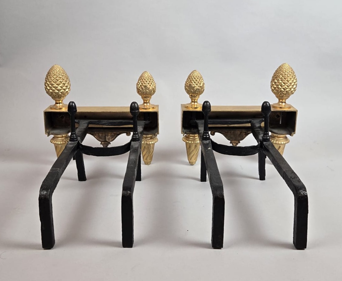 Pair of Louis XVI period gilt bronze andirons