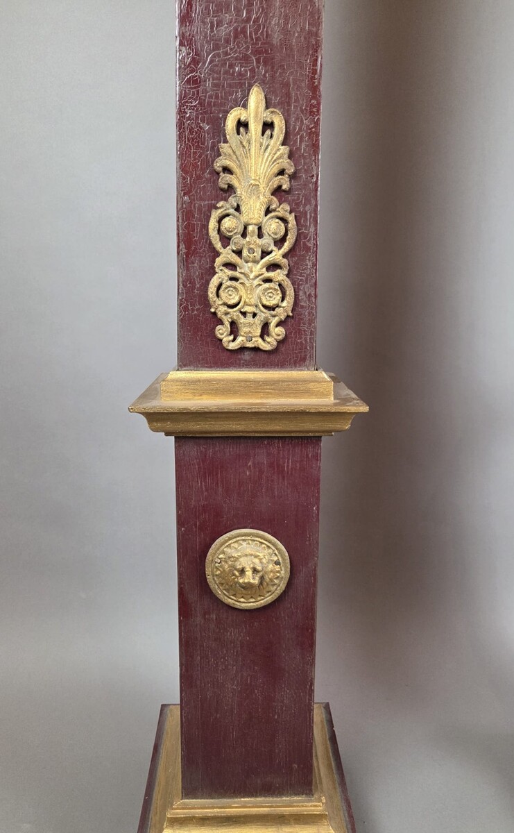 Pair of obelisks in painted wood with ormolu ornamentation, early 20th century