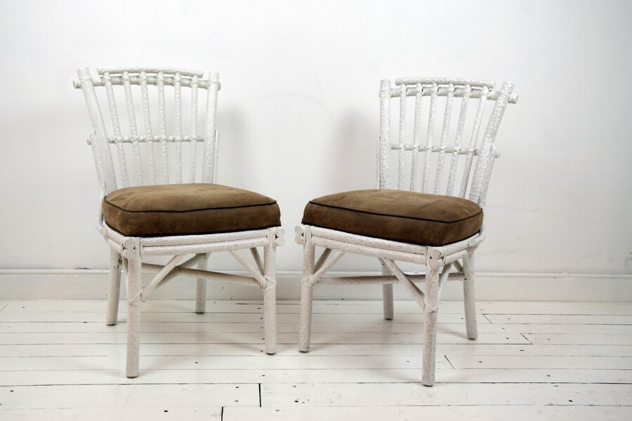 Pair of white bamboo chairs