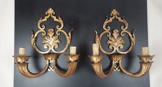 Pair of wrought iron and gold sheet metal wall lights