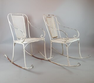 Pair of wrought iron and perforated metal rocking chairs, circa 1960